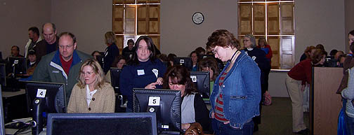 Parents get assistance with filling out financial aid documents during the 2008 College Goal Sunday.