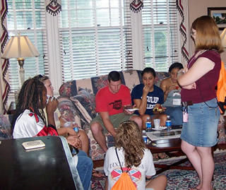 Students gather at a reception before the school year begins