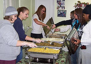 Community service is a familiar experience for many Tusculum students such as these who help serve a meal at a local church's soup kitchen.