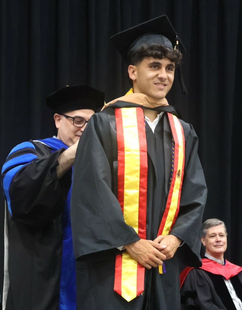 A student is hooded.