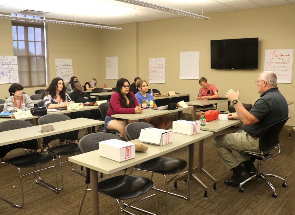 Jamey Anderson, right, teaches the forensics class.