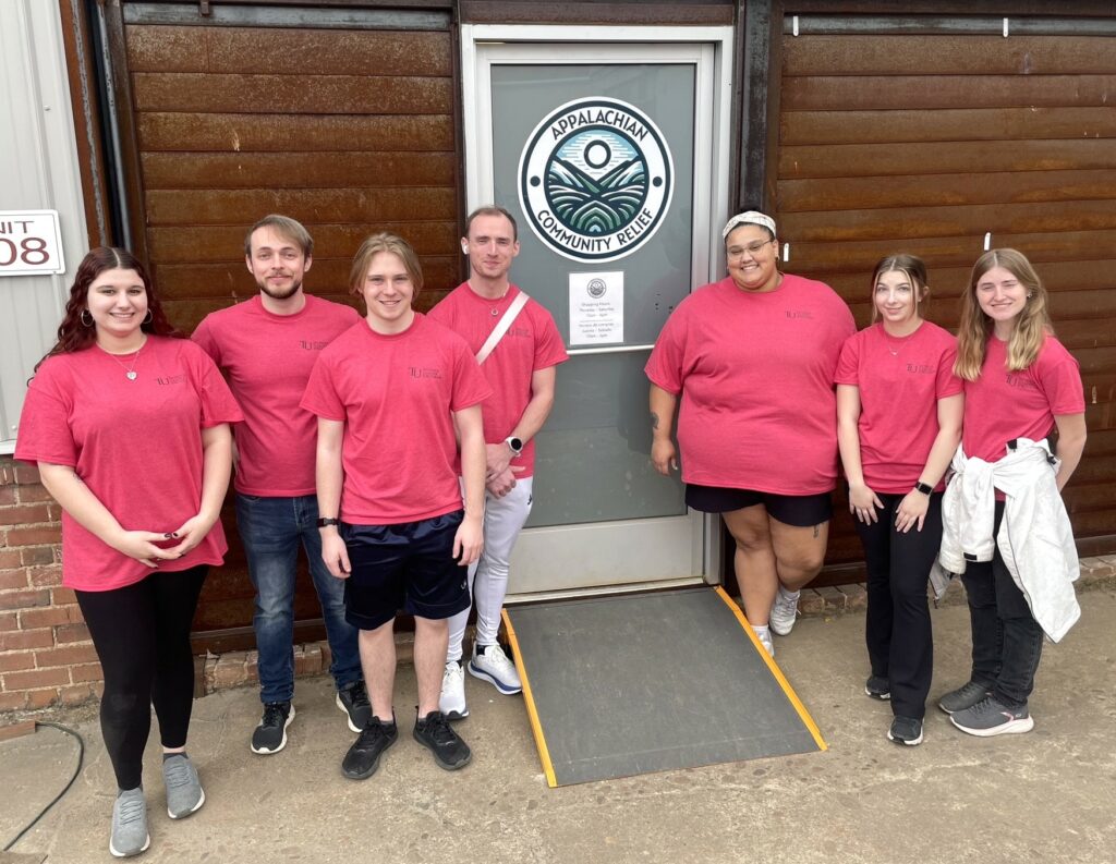 The Tusculum group stands outside Appalachian Community Relief. Left to right are Janelle Zirger, Justice Upp, Joseph Medeck, Miles Crouse, Jaylin Parker, BriAnna Higgins and CJ Johnson.
