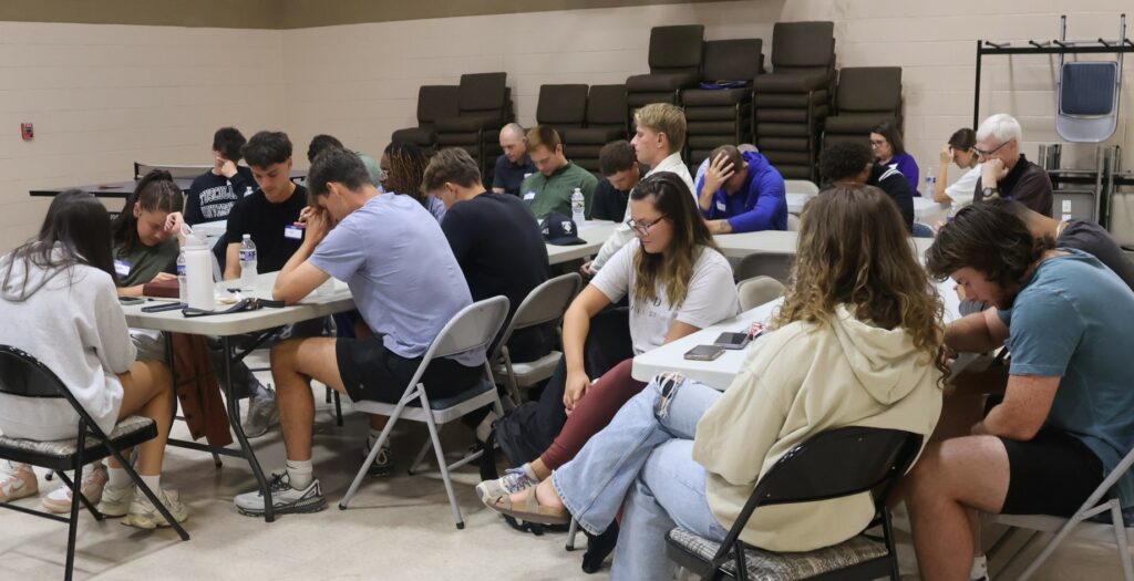 Students pray at SPOT.