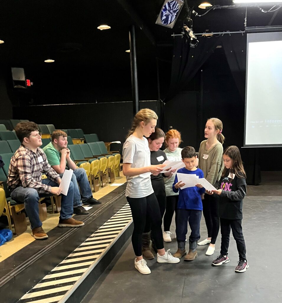 Potential cast members audition for "Newsies."
