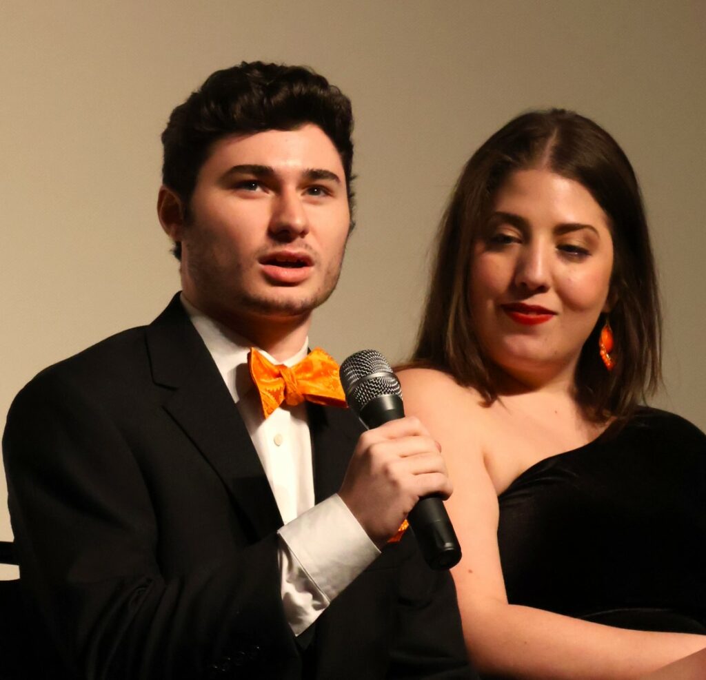 Todd Wallin, left, speaks as Josie Norton listens.