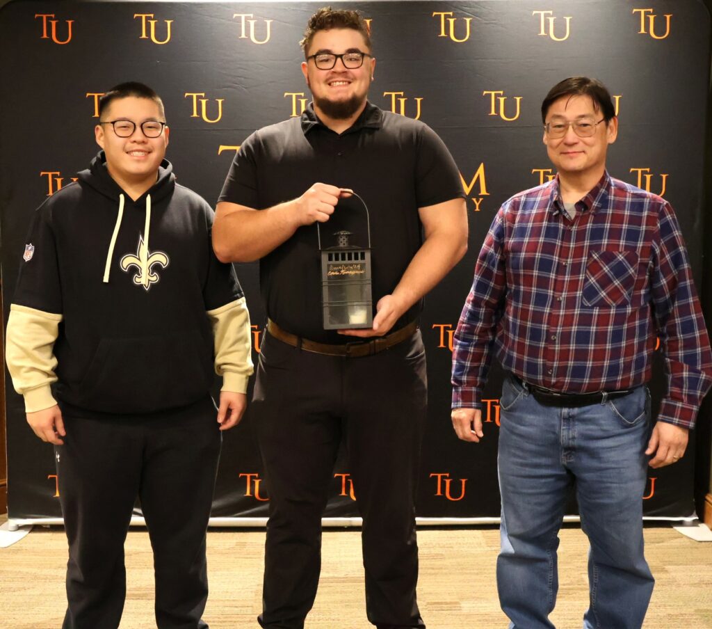 Left to right are Daniel Wan, Corbin Tomaszewski and Dr. Harold Branstrator.