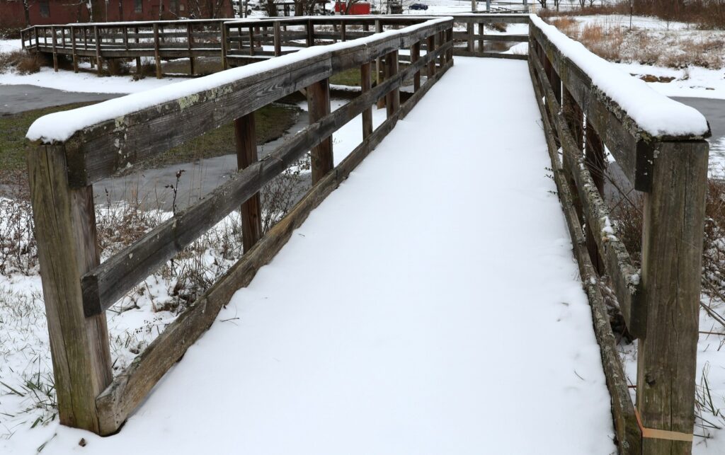 Snow on the bridge at the Paul E. Hayden Educational Wetland
