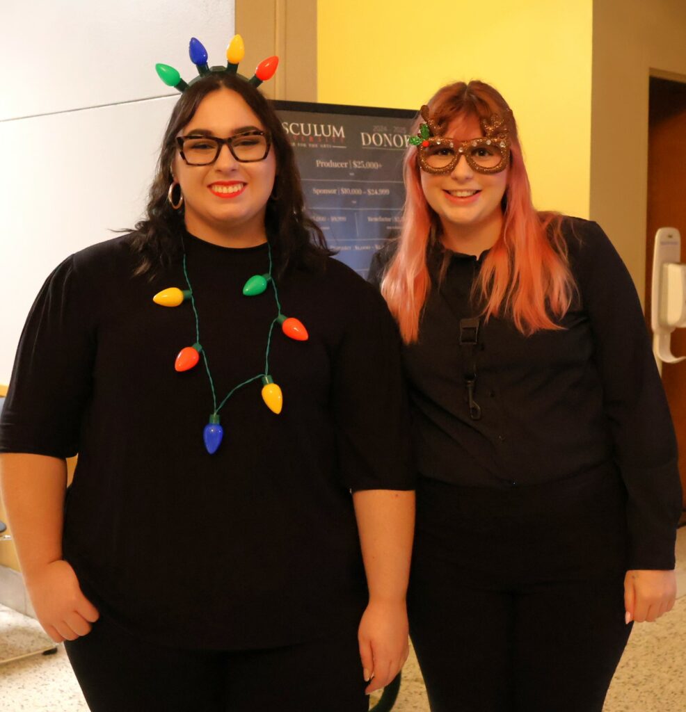 Tusculum students Emily Mosley, left, and Hannah Morgan were in the Christmas spirit with their attire.