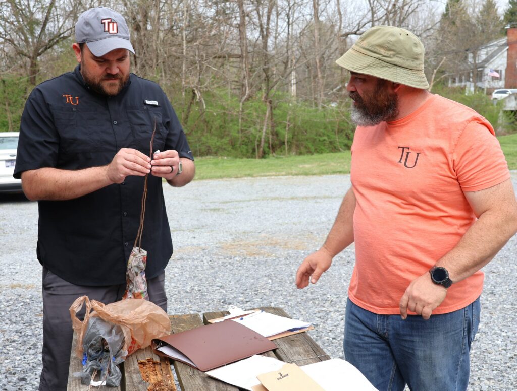 Jordan Baker, left, assistant professor of biology, and Dr. Peter Noll, professor of public history and museum studies, work on an order.