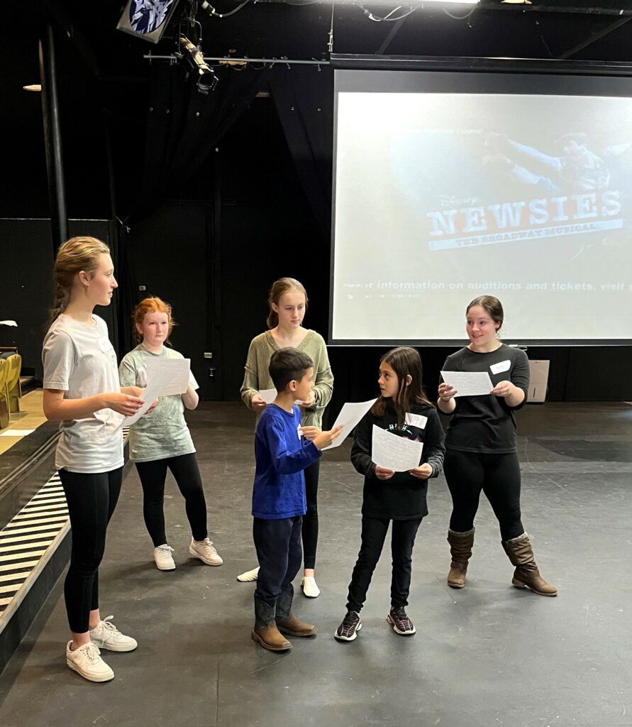 Potential cast members audition for "Newsies."