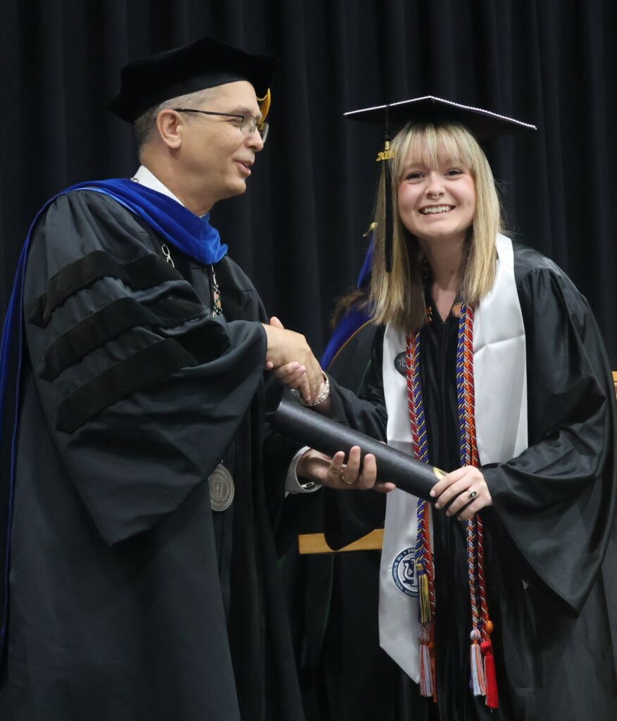 Dr. Hummel, left, congratulates Emily Massengill.