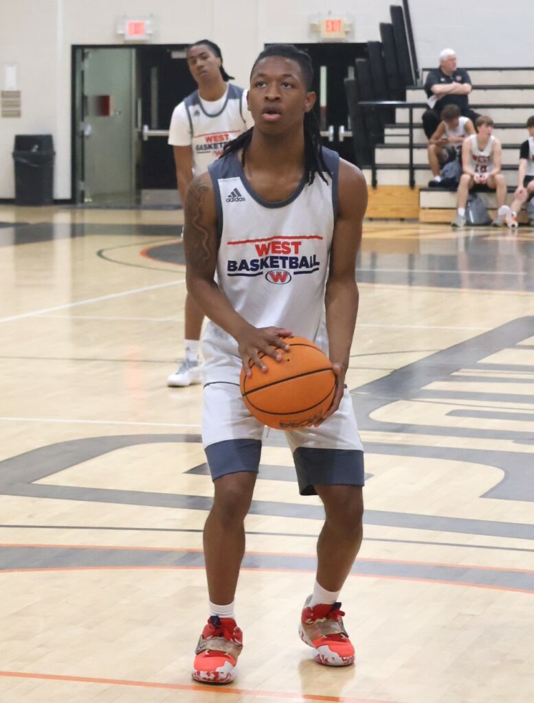A player prepares for a free throw.