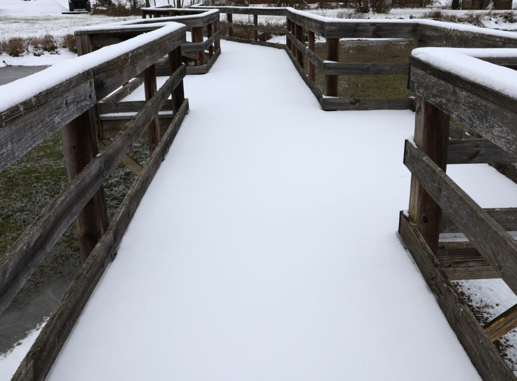 Snow on the bridge at the Paul E. Hayden Educational Wetland