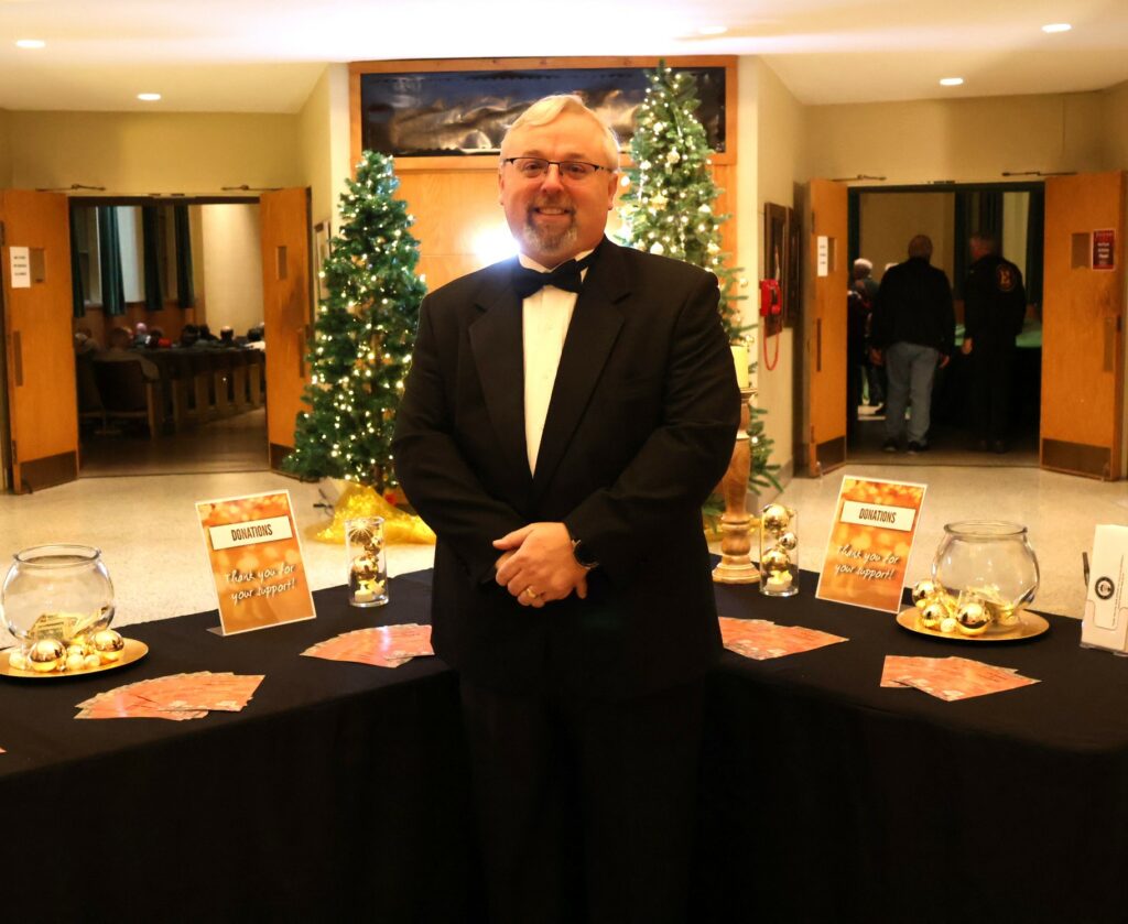 Conductor Chris Chambers poses in the lobby.