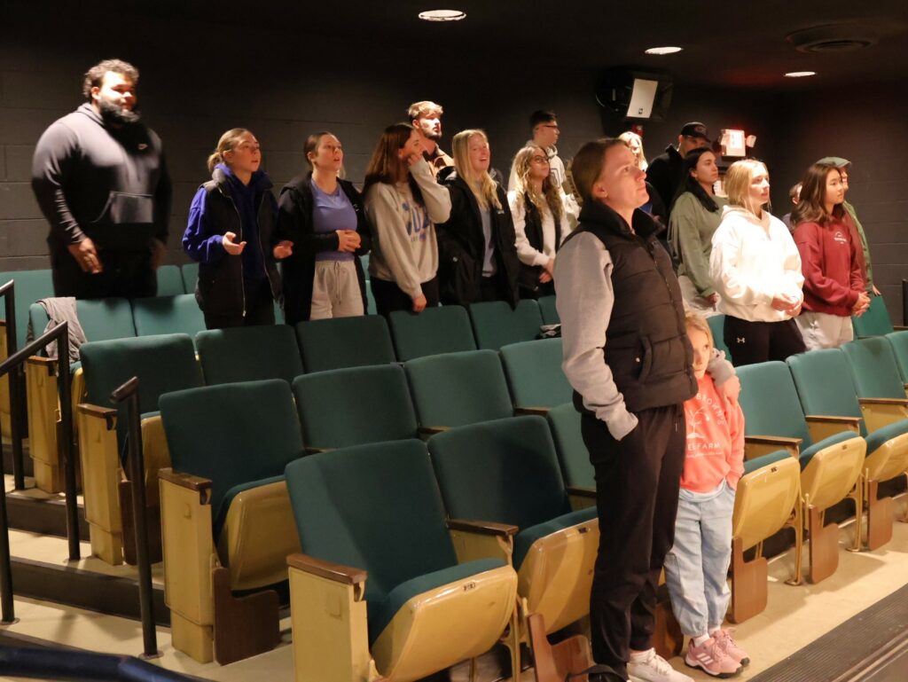 Tusculum students and community members sing to the music.