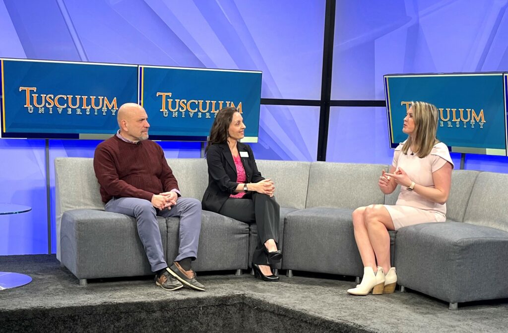Kelly Grosfield, right, a WJHL anchor, speaks while Bill Bledsoe, left, and Rouja Green listen during an interview.