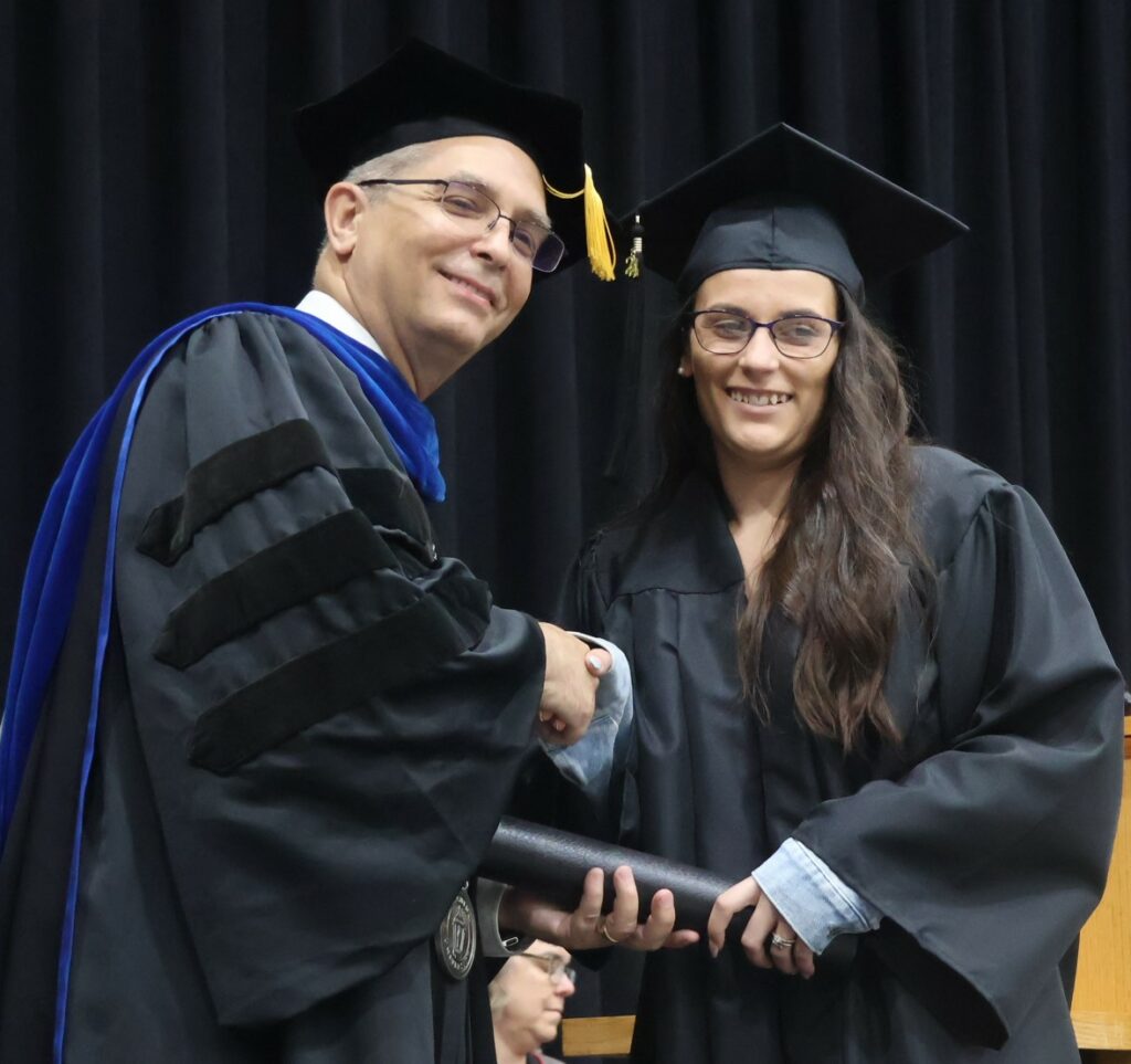 Dr. Hummel, left, congratulates Angel Wright.