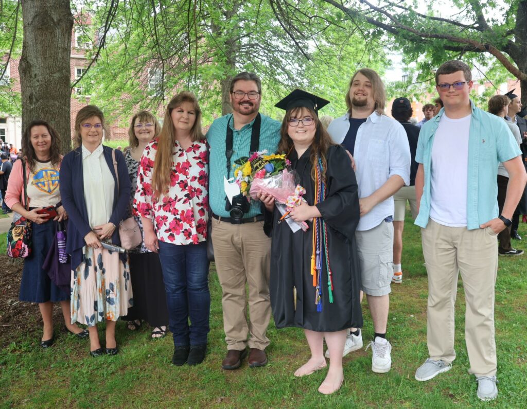 Nicole Bailey, right, celebrates her graduation with her supporters.