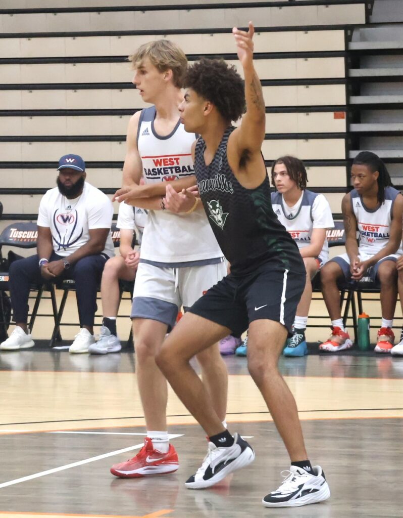 Two players compete during the J.T. Burton Team Camp.