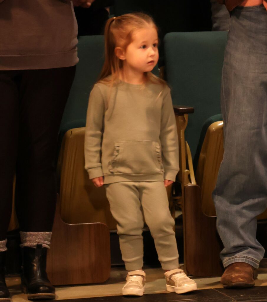 A child enjoys the music.