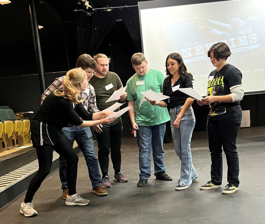 Potential cast members audition for "Newsies."