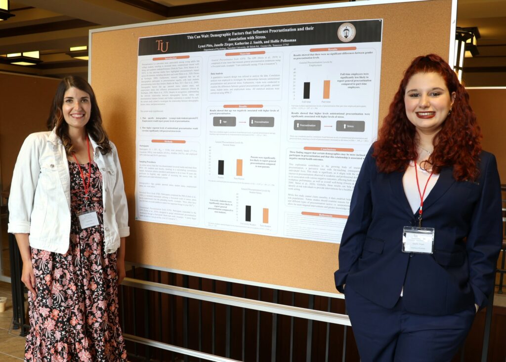 Lynzi Pitts, left and Janelle Zirger stand by their poster.
