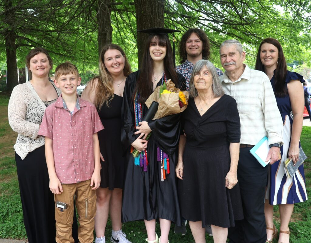 Alex McBrien, middle, celebrates with her supporters.