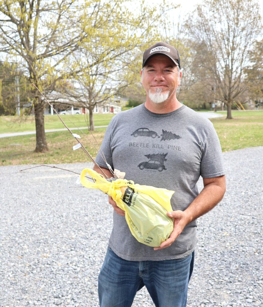 Larry Horn holds his seedlings.