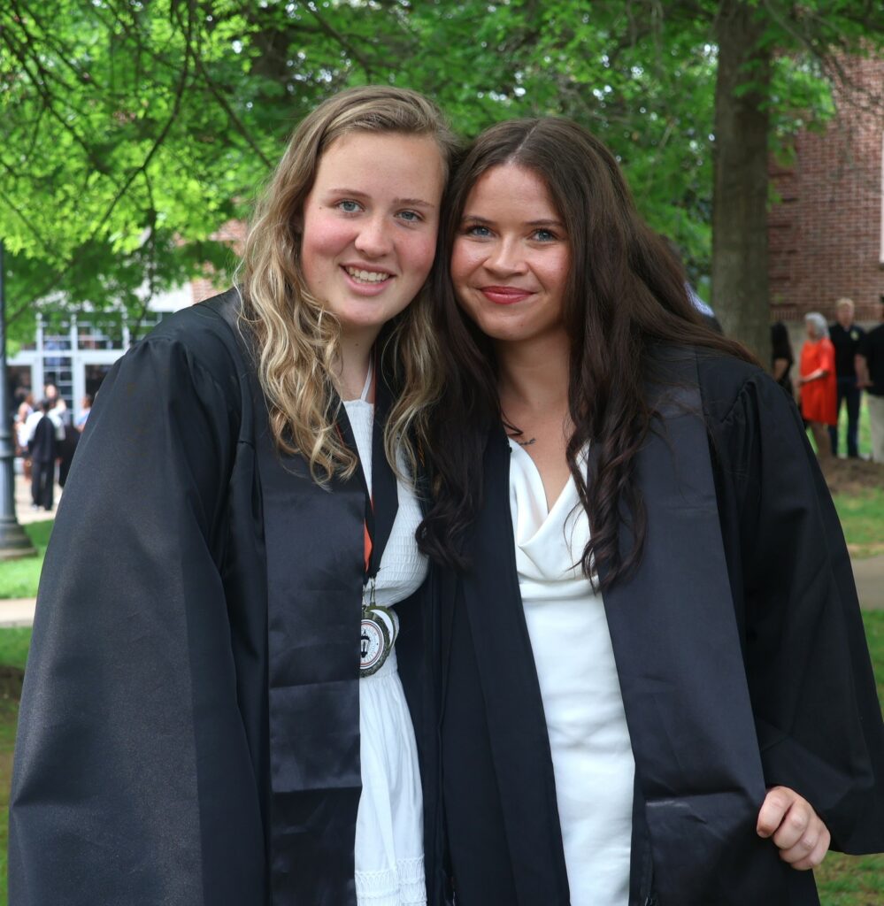 Emma Harriman, left, and Trystan Wepking Wepking celebrate after graduation.