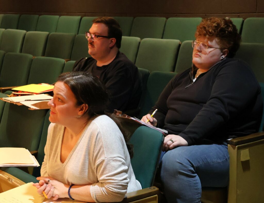 Left to right, directors Erin Schultz, Andy Ross and Dodger Kirkland watch the auditions.