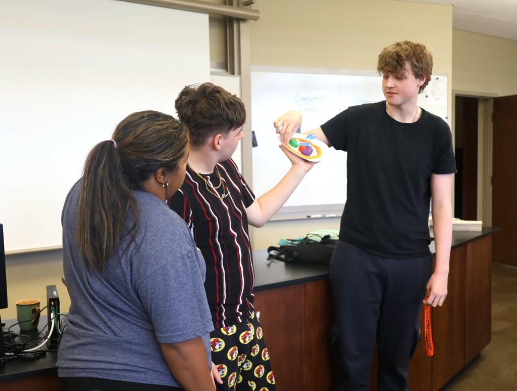 Students make a presentation in their biology class.