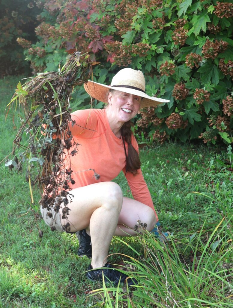 Kelsey Trom, associate professor of English, shows some of her landscaping work.