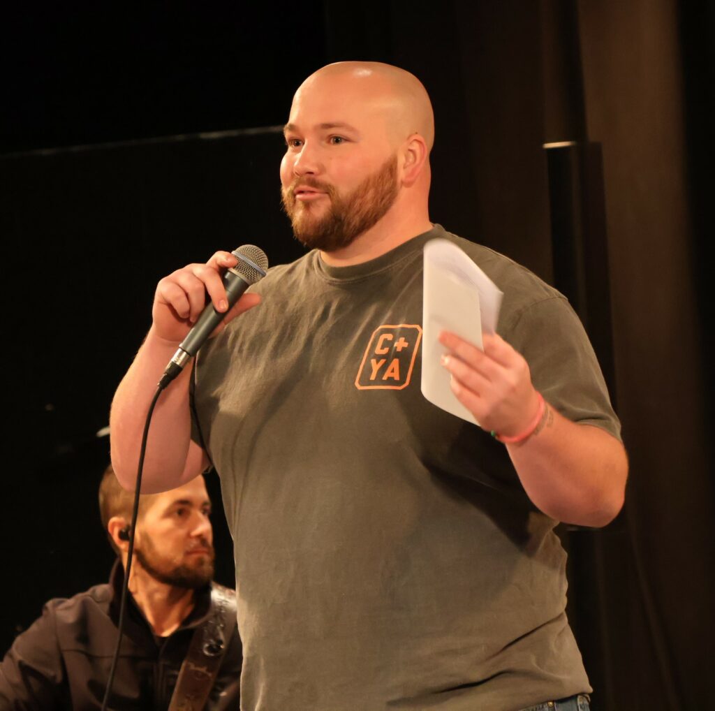 Harrison Nasekos greets the audience.