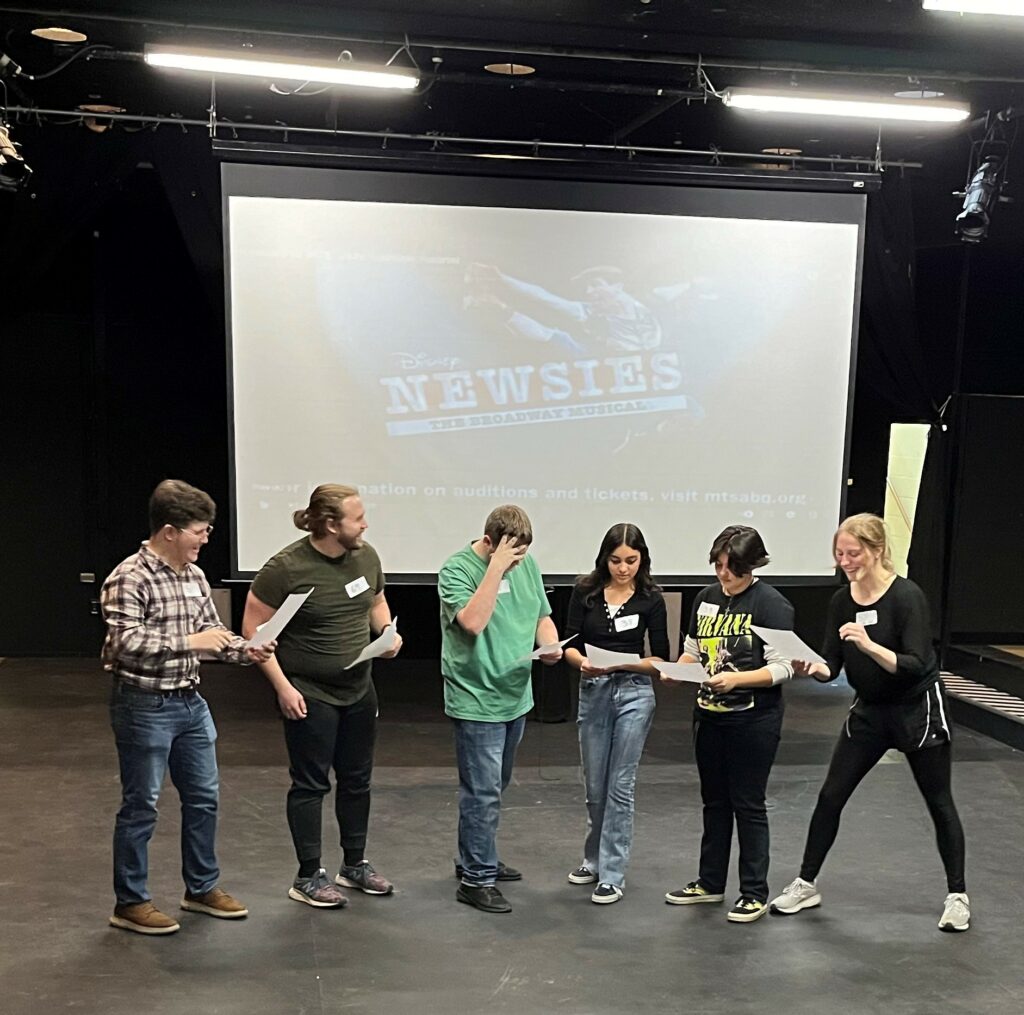 Potential cast members audition for "Newsies."