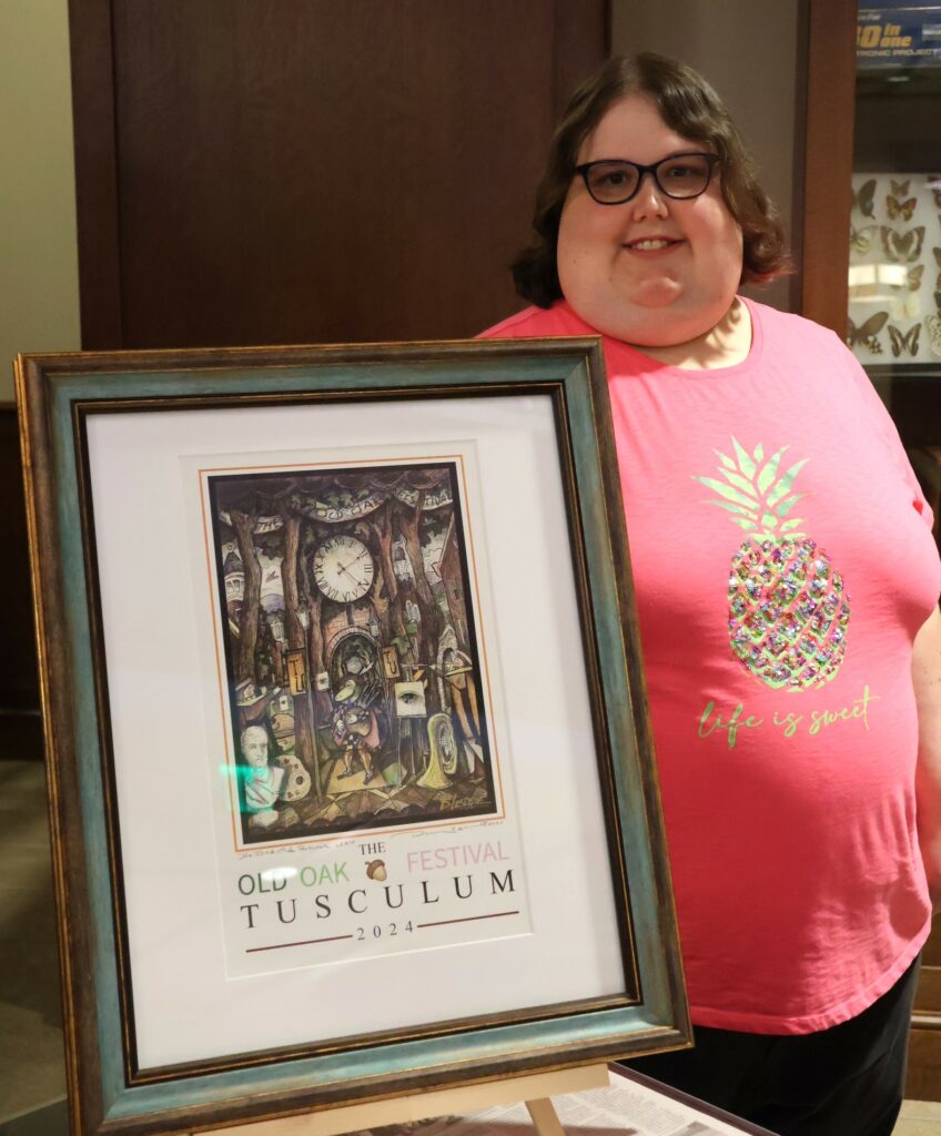 Alumna Ashley Howell stands by a project in which she participated.