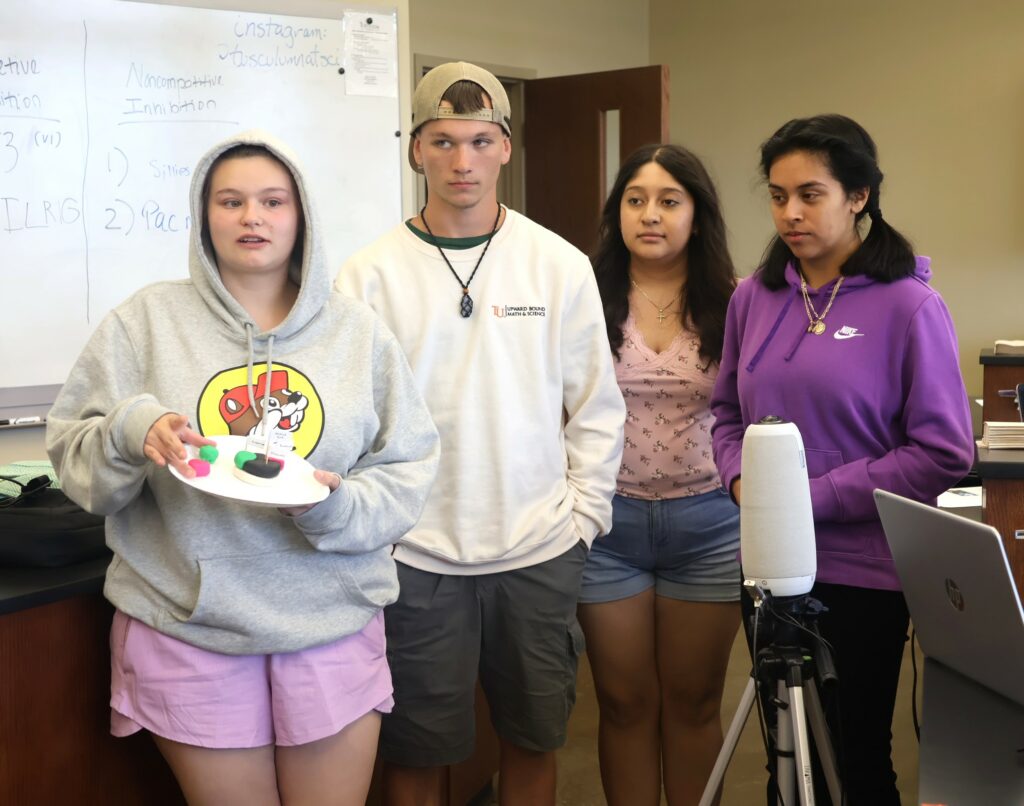 Students make a presentation in their biology class.