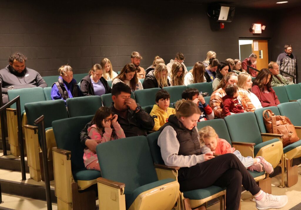Tusculum students and community members pray.