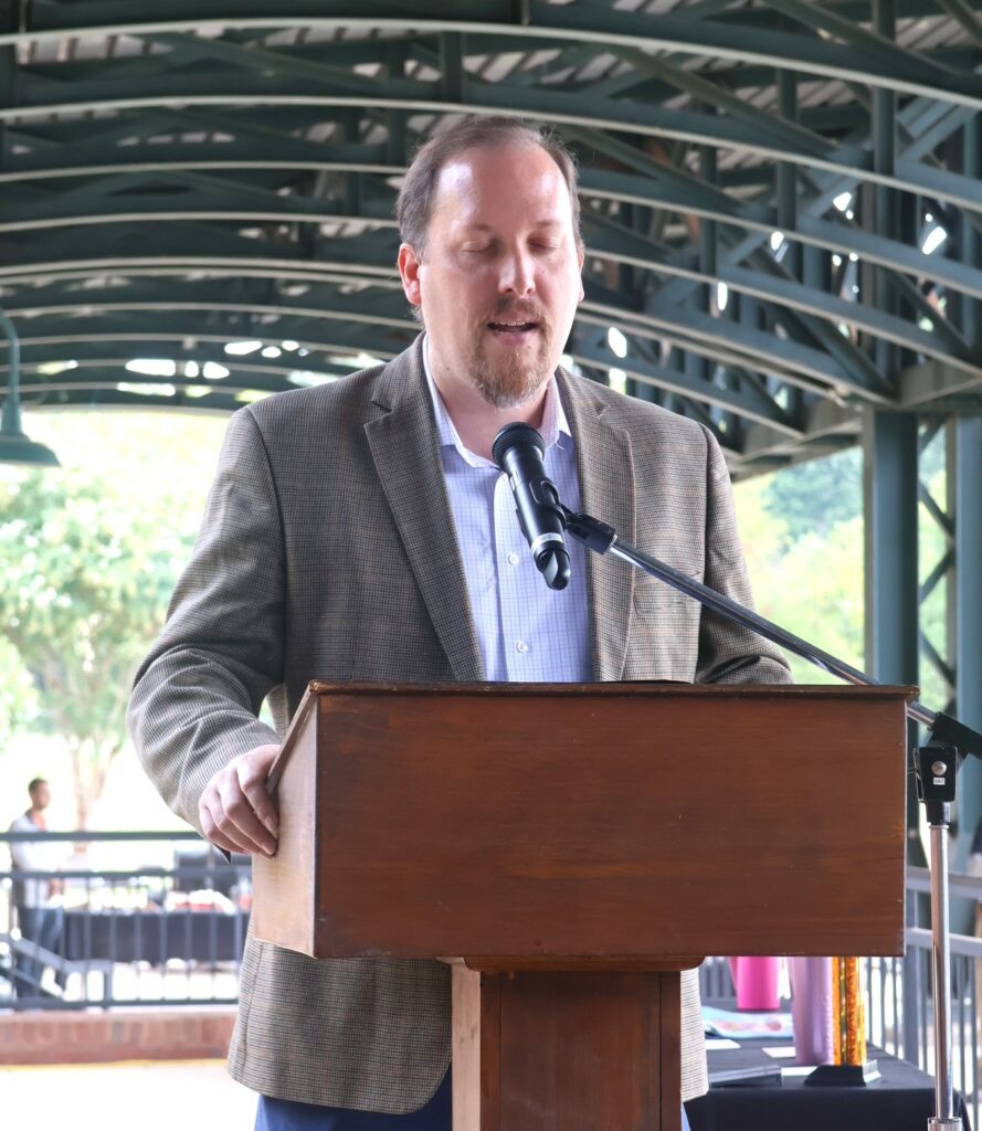 Dr. David Cook prays.