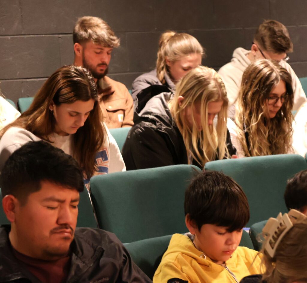Tusculum students and community members pray.