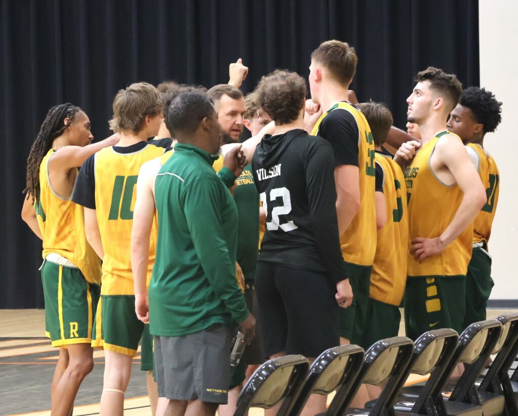 A team prepares to return to the court for further play.