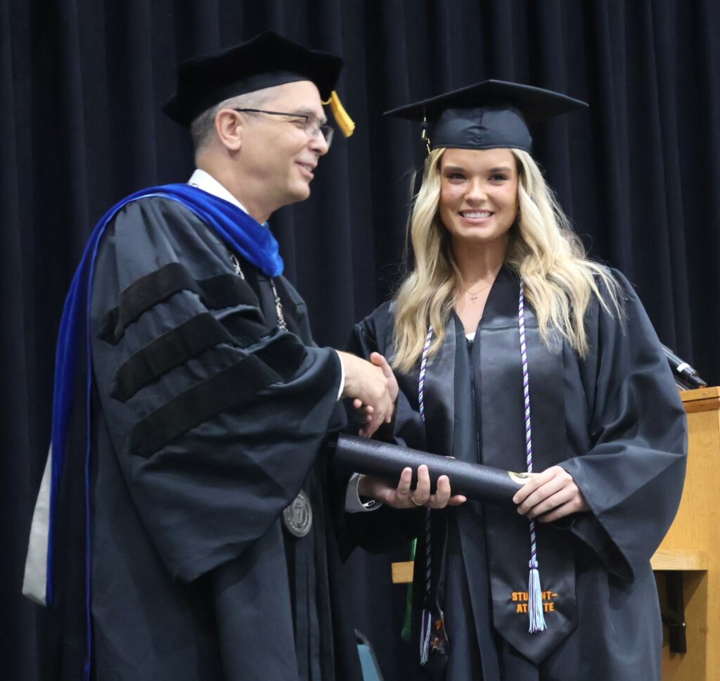 Dr. Hummel, left, congratulates Savannah York.