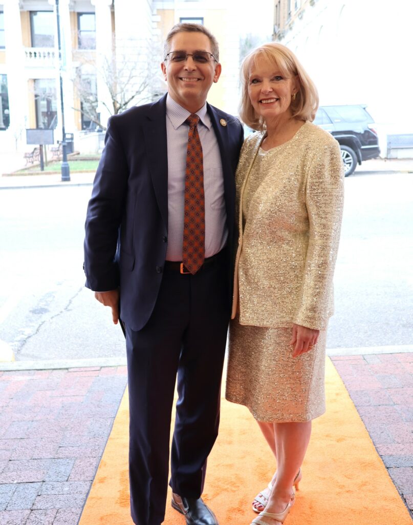 Dr. Scott Hummel and his wife Starr pose on the orange carpet.