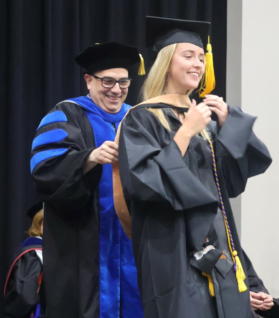 A student is hooded.