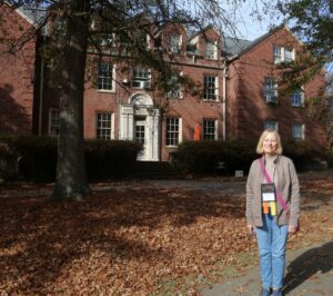 Janet Friedman stands in front of Rankin Hall.
