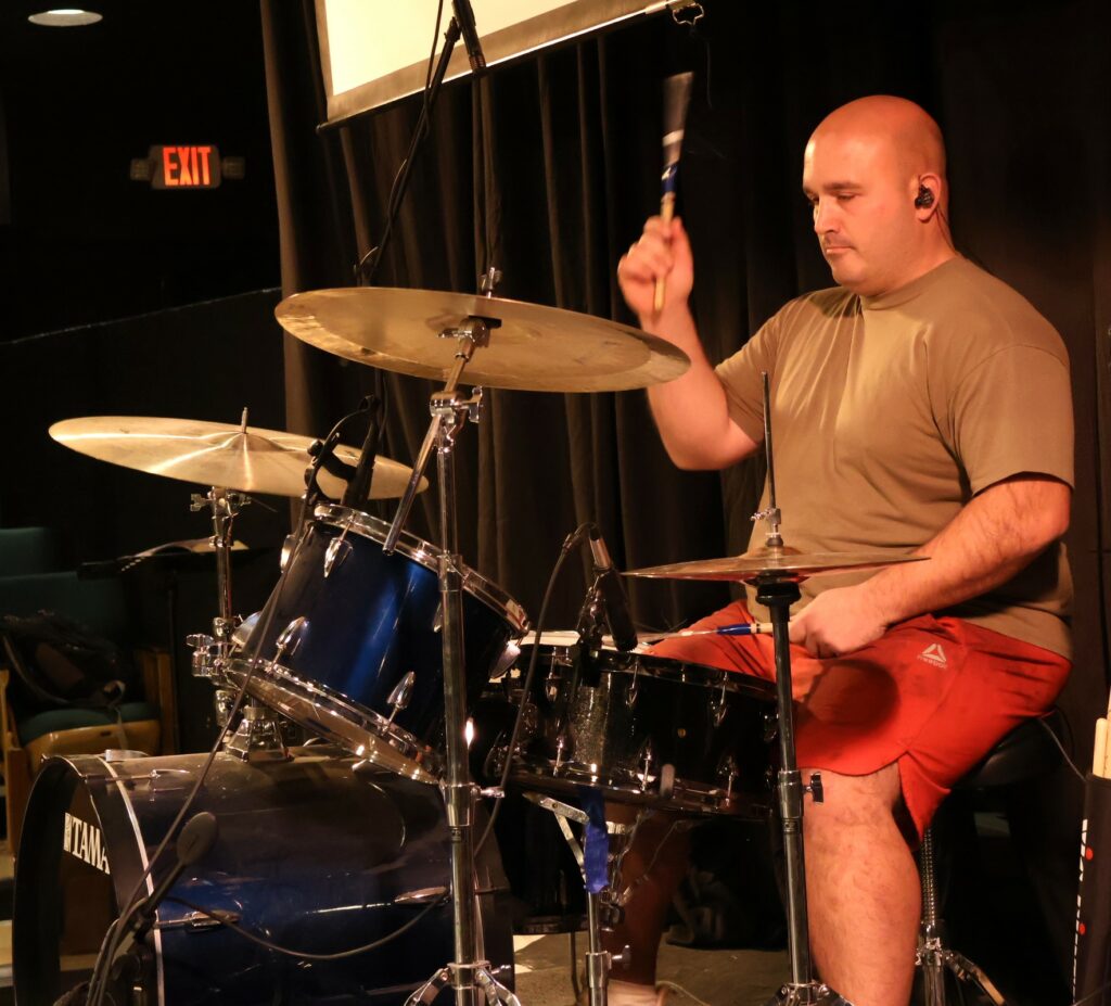 The drummer plays.