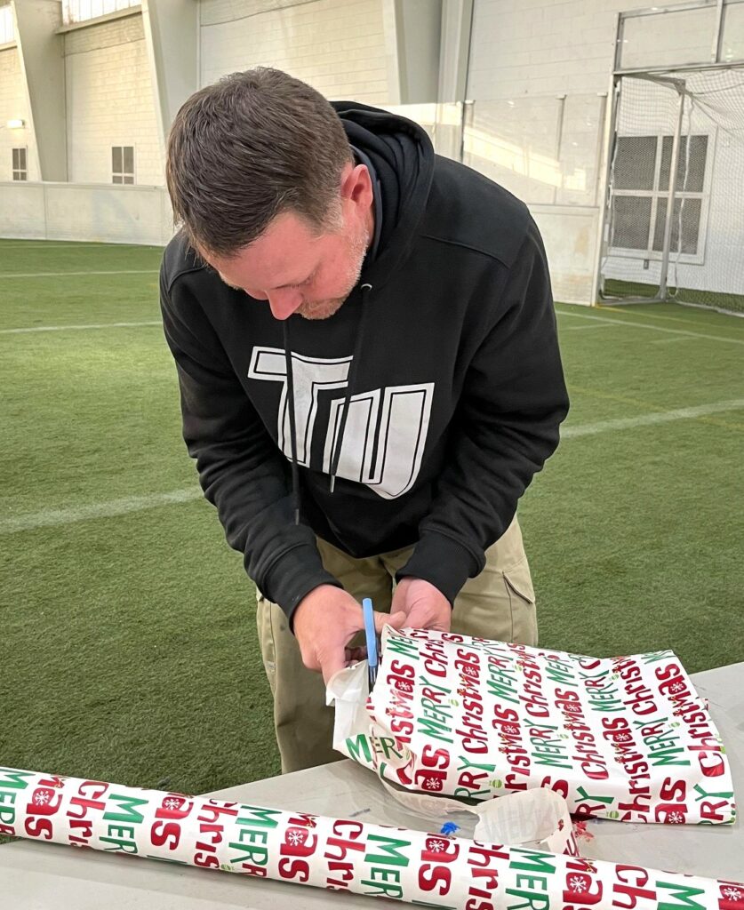 TJ Turner wraps a gift.