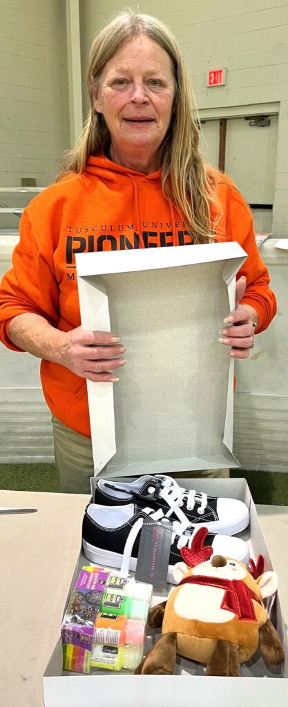 Linda Bible shows some of the items she wrapped.