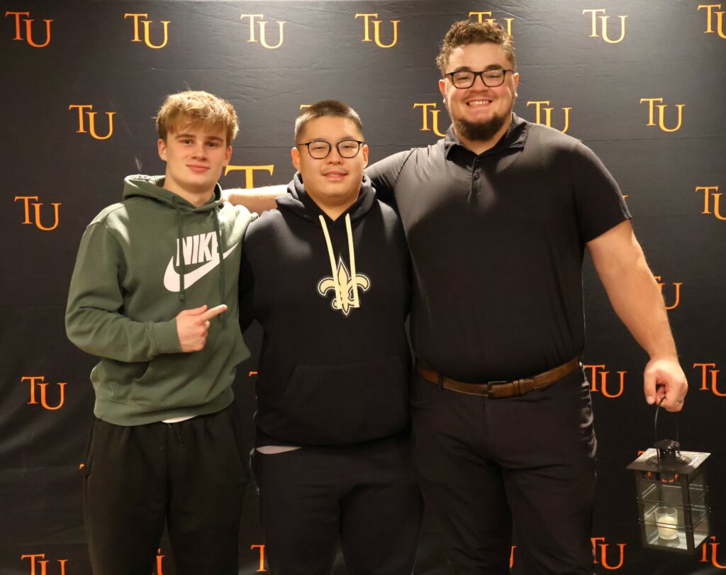 Left to right are Logan Farless, Daniel Wan and Corbin Tomaszewski.