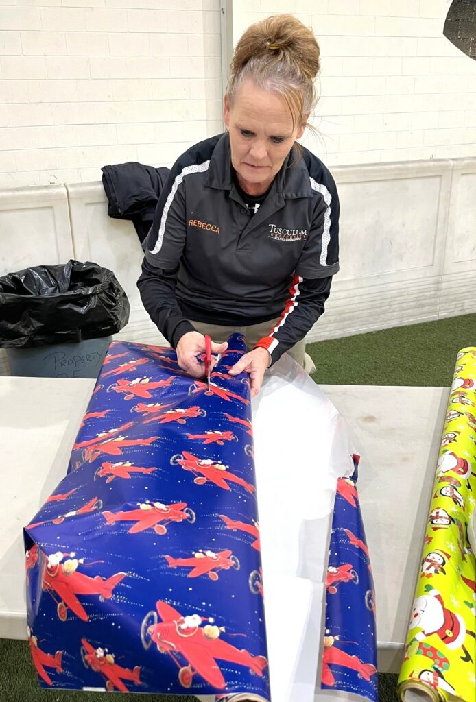 Rebecca Wood wraps a gift.