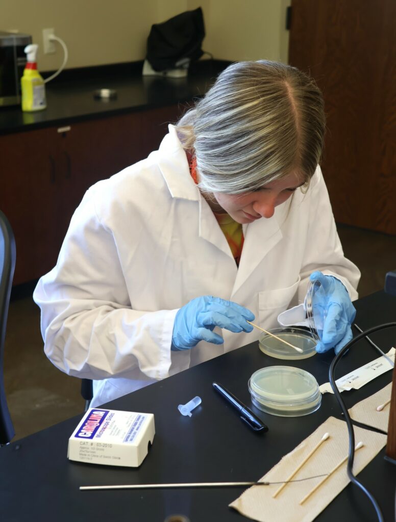 A student works on a project in her microbiology class.